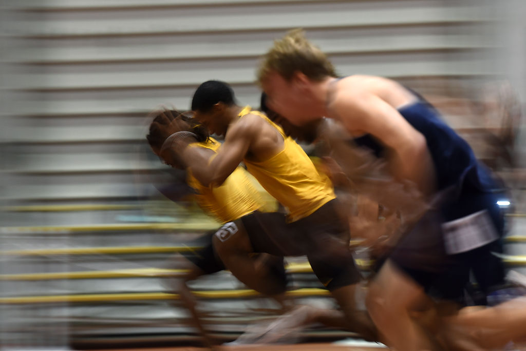 Track athletes run in the 60 meter dash Friday, Dec. 6, 2019 at Hearnes Field-house in Columbia.